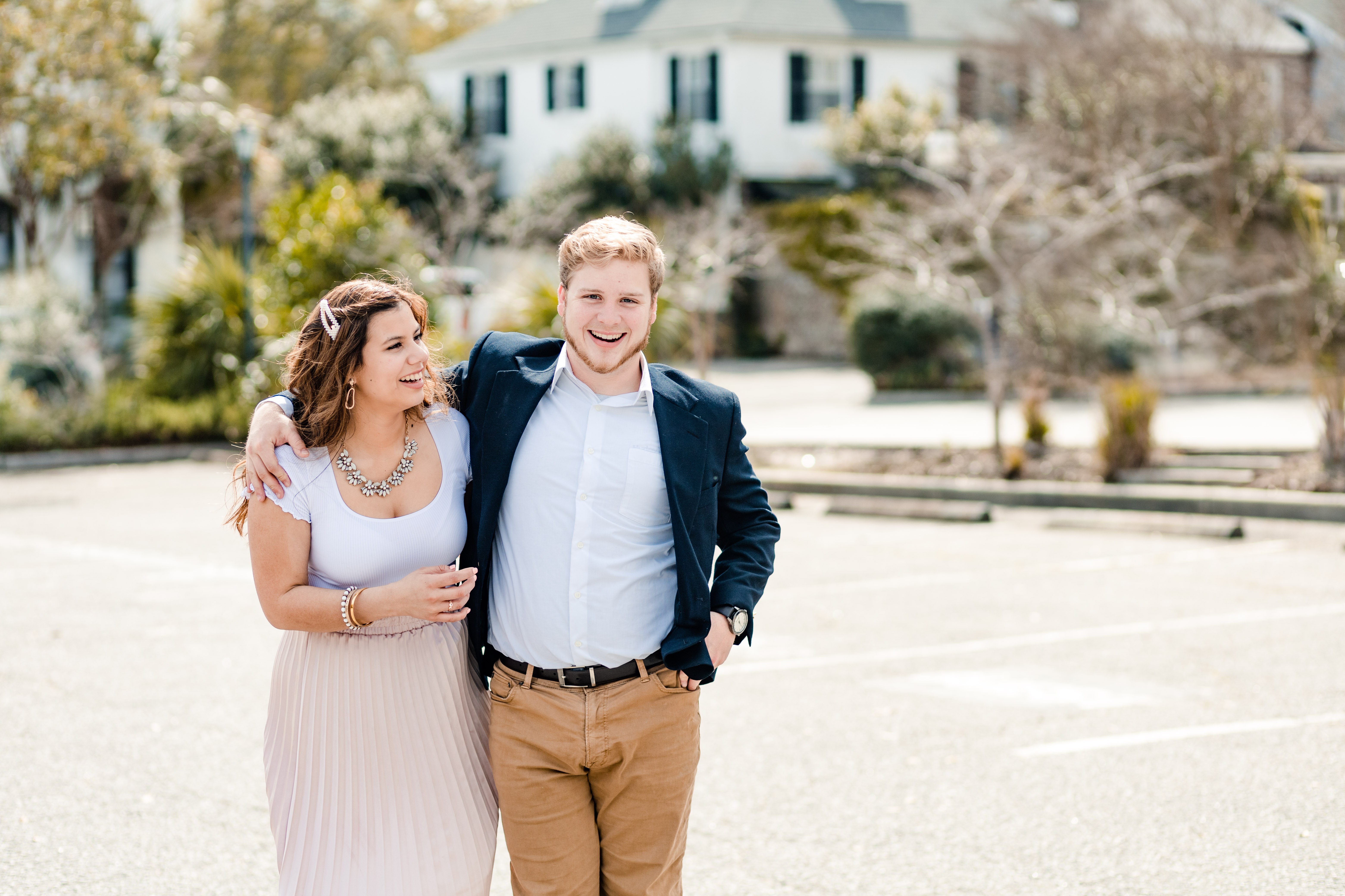couple walking in downtown charleston during their engagement session