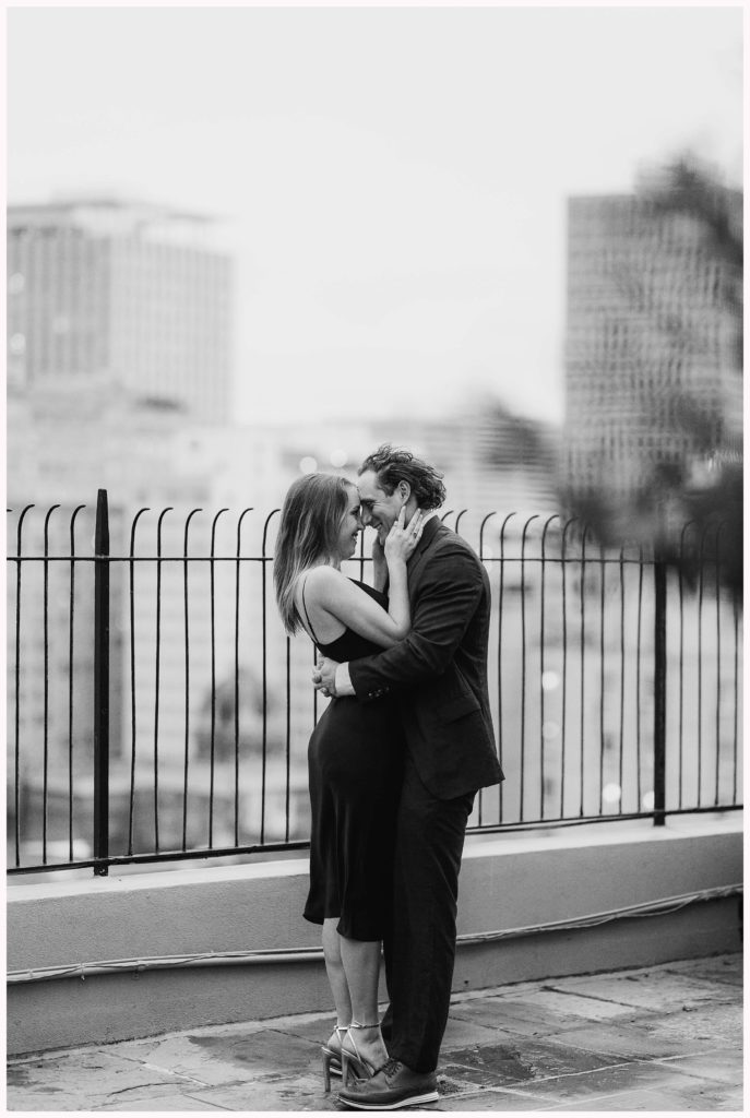 romantic engagement photo on the top of the hotel montelone in charlotte