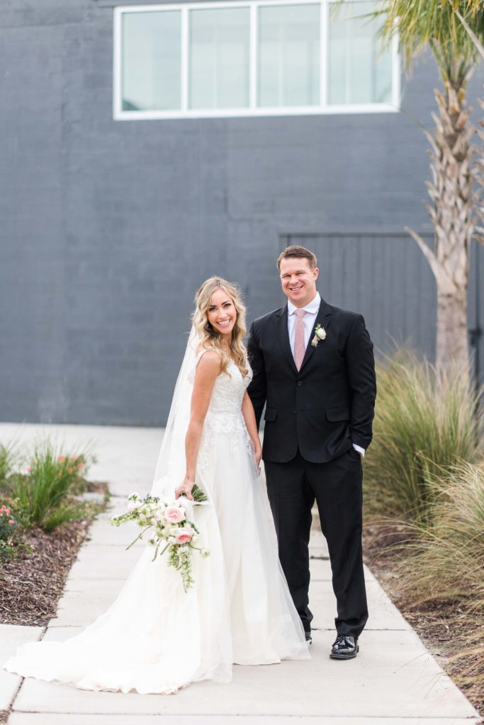 charleston couple smiles at the arbor room