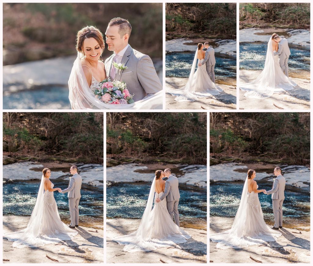 bride and groom pose near water on their wedding day
