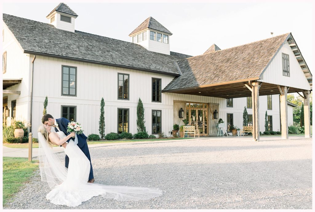 bride and groom share a kiss at bridlewood of madison