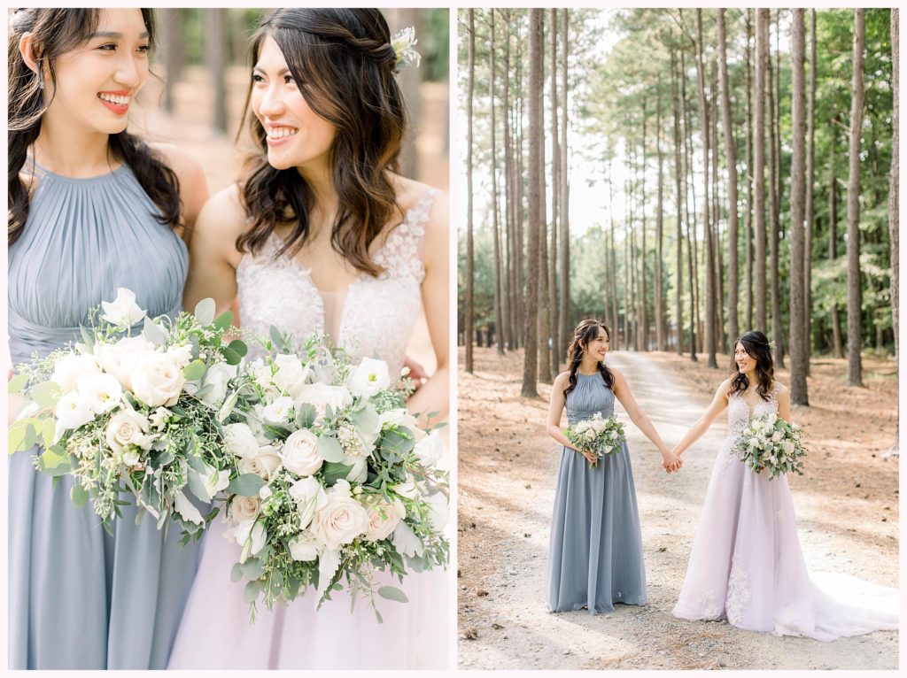 bridesmaid poses with bride on wedding day amongst tall trees