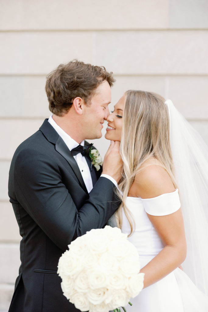 bride and groom in classic southern white dress and black tuxedo